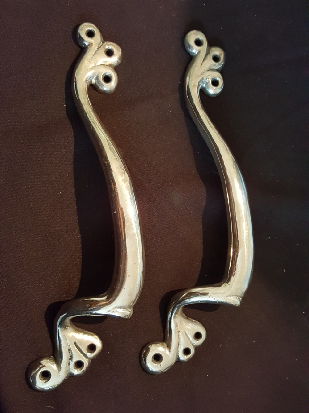 pair of cast polished art nouveau door pull handles