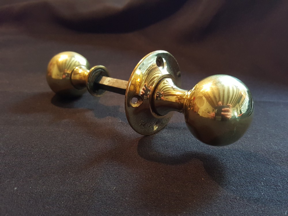 one pair of edwardian brass rimlock door knobs