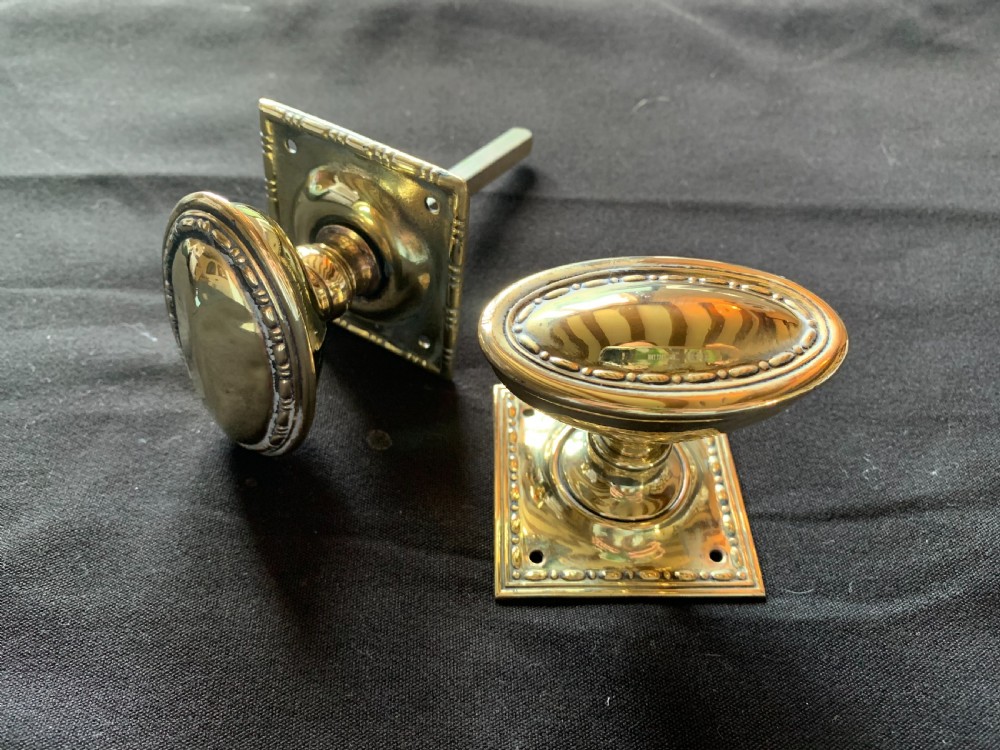 sa018 pair of brass regency oval door knobs