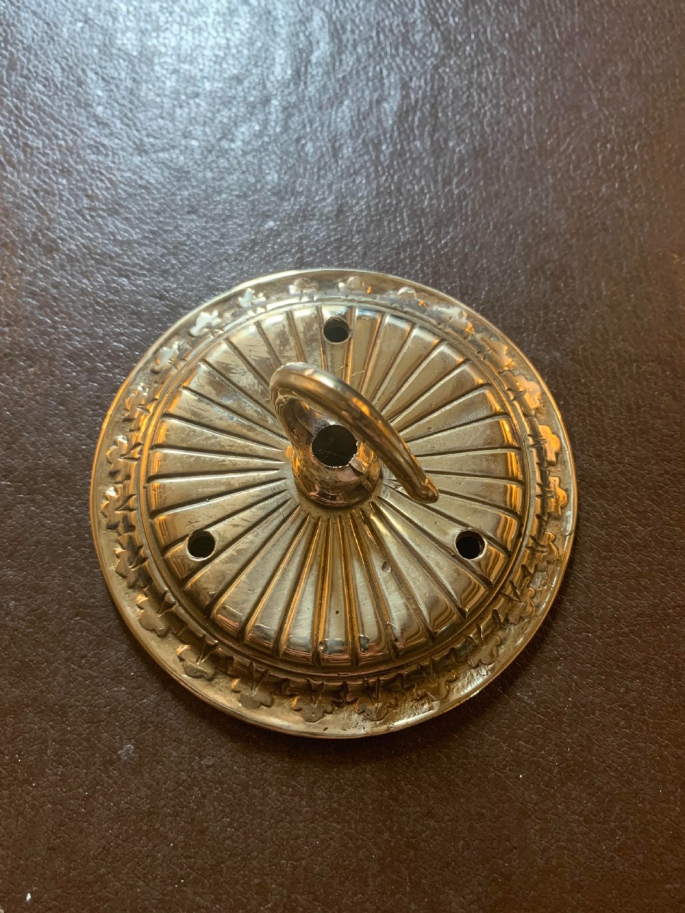one small brass victorian ceiling rose