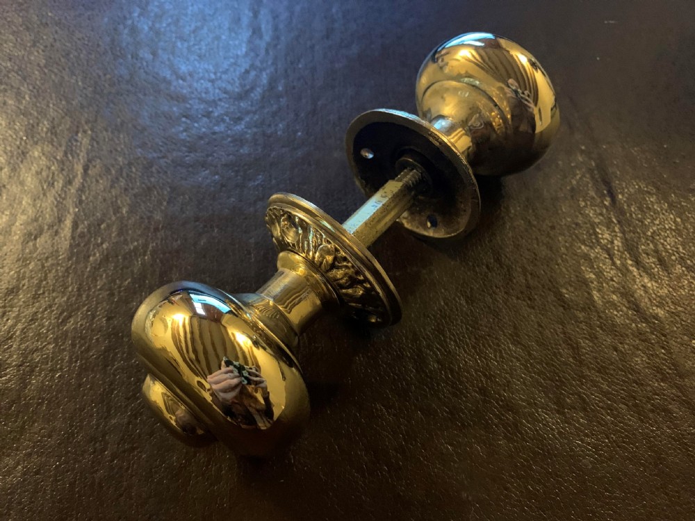one pair of brass georgian door knobs